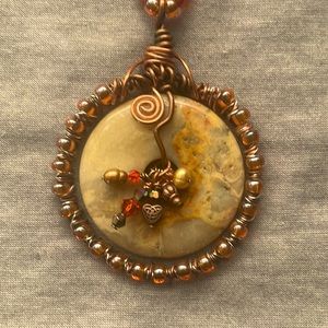 Beautiful handmade necklace with flat disc of Tiger’s Eye - chain length 33”.